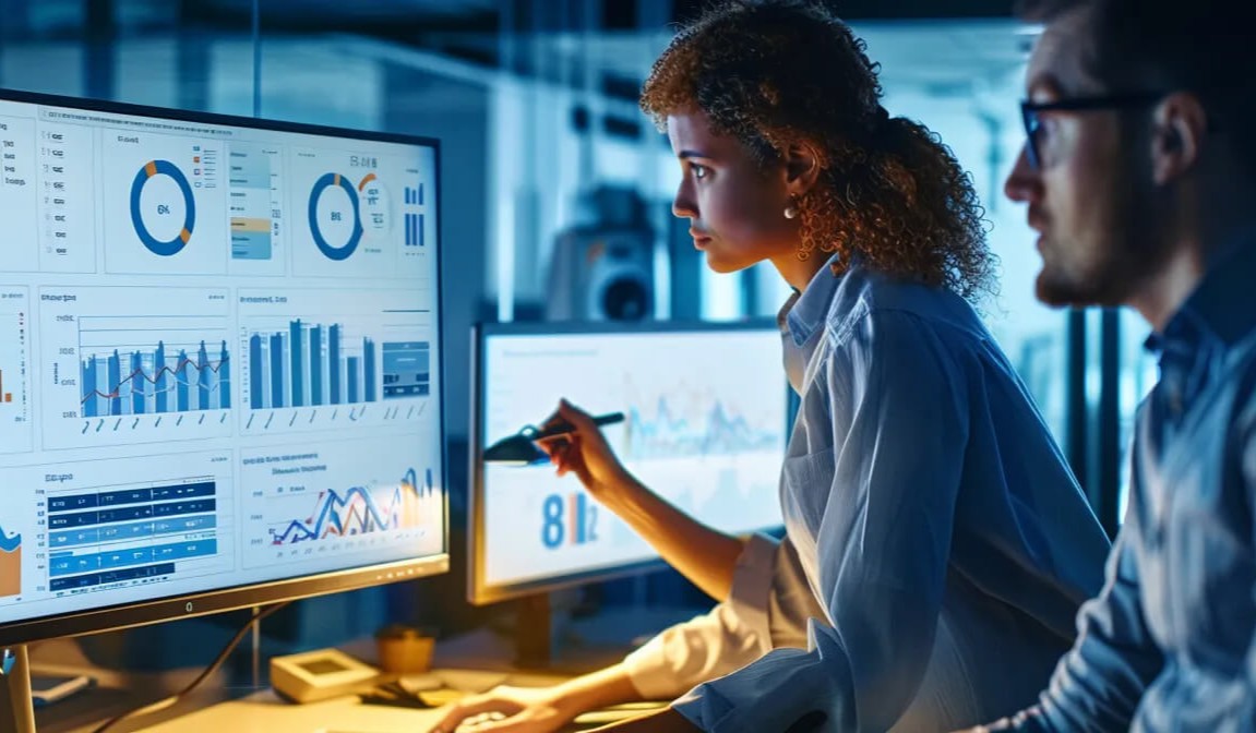 Two business professionals discuss analytics from top account planning tools